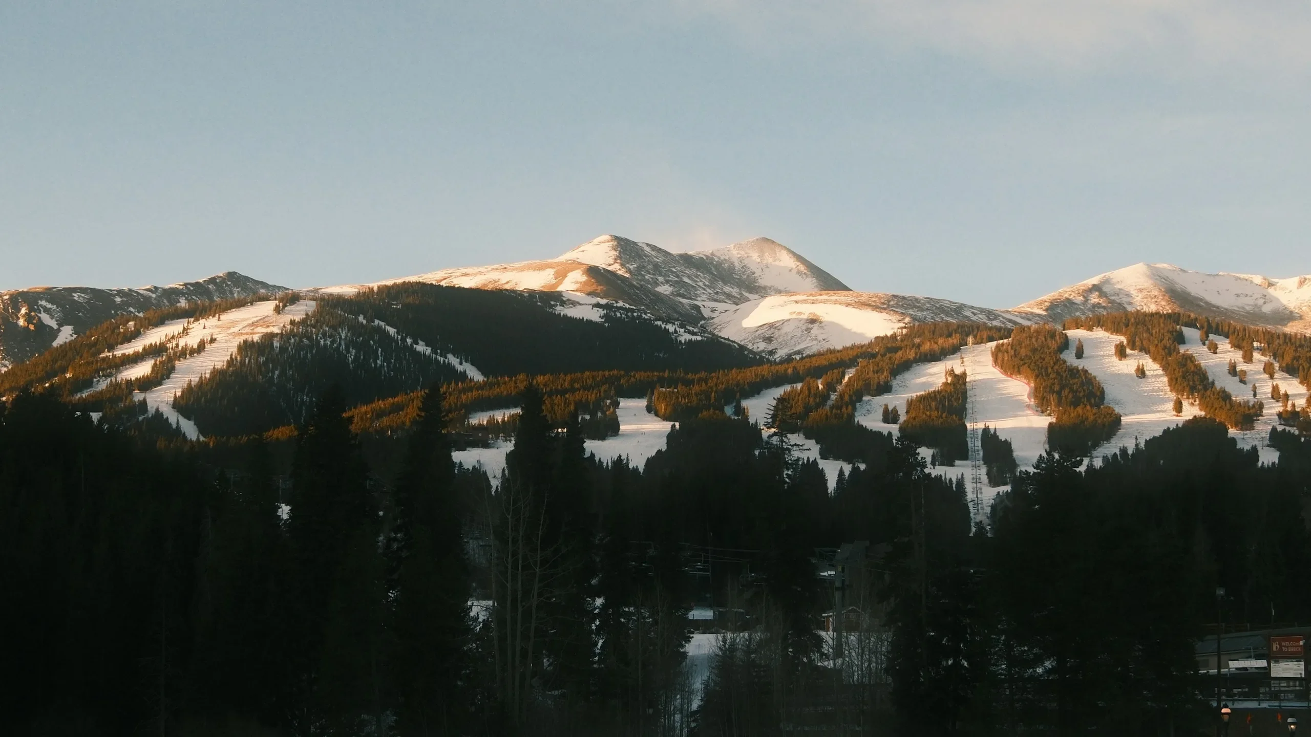 Warm light across the snow-covered peaks above Breckenridge, Colorado